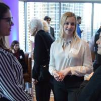 Three alumnae's enjoy conversations with one another